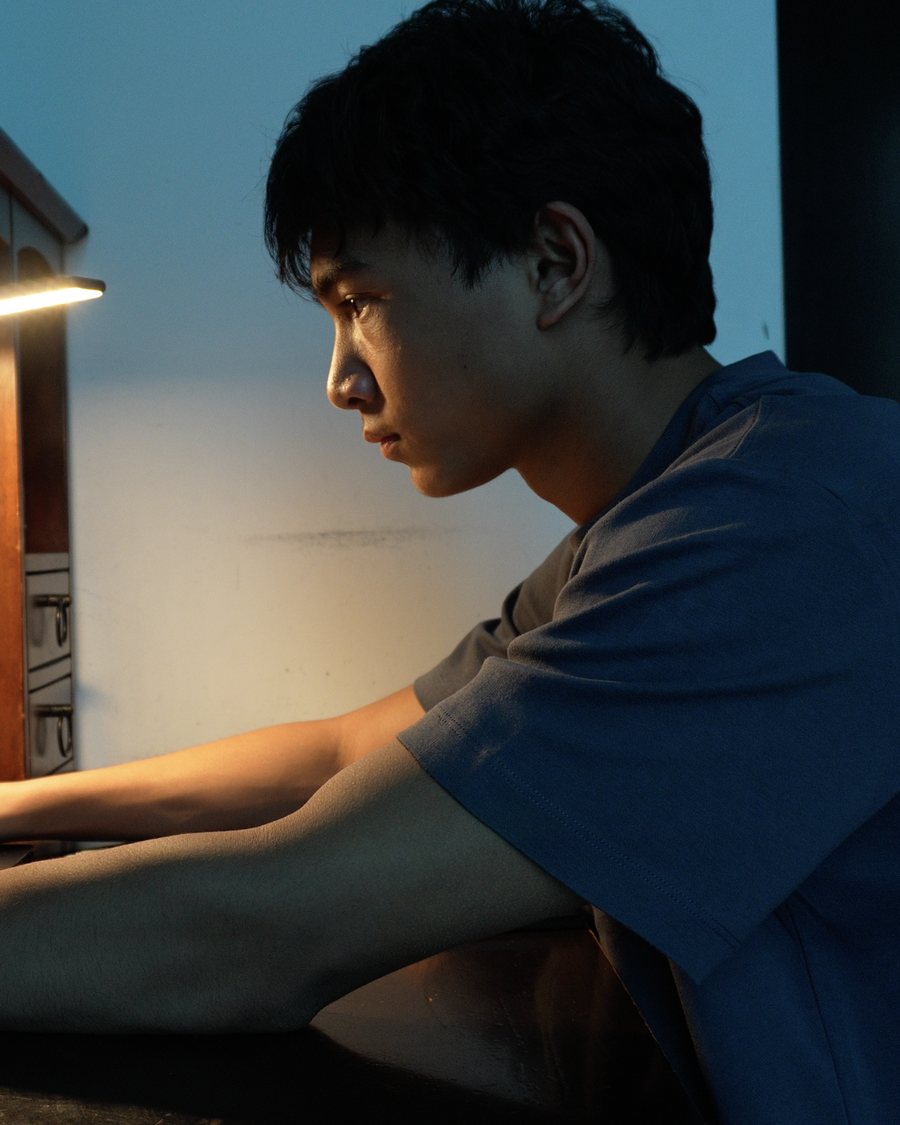 Reodan Nathan, working at a laptop at night